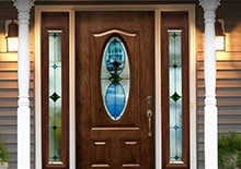 Wooden door entryway with custom window designs