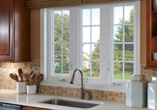 3 rectangular white windows above sink