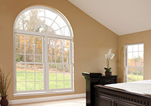 White bedroom window with half moon feature