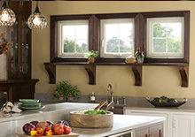 3 small wooden framed white kitchen windows