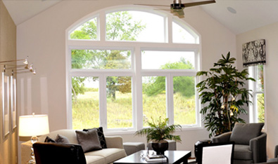 White windows and half moon window in living room