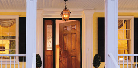 Dark coated wood double door entryway